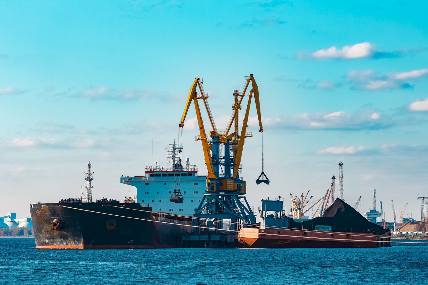 Geared bulk carrier alongside a loading terminal
